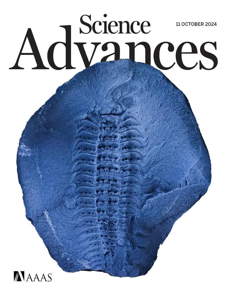 The cover of an issue of Science Advances with a fossil myriapod on it - a black coated fossil arthropod with lots of segments, and many spines.