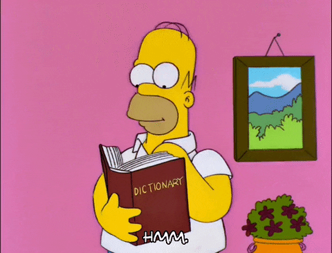 Homer Simpson reading a dictionary